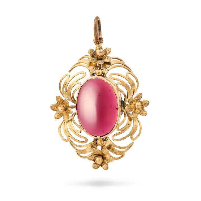 A GARNET PENDANT the pendant set with an oval cabochon garnet, the frame accented by flower