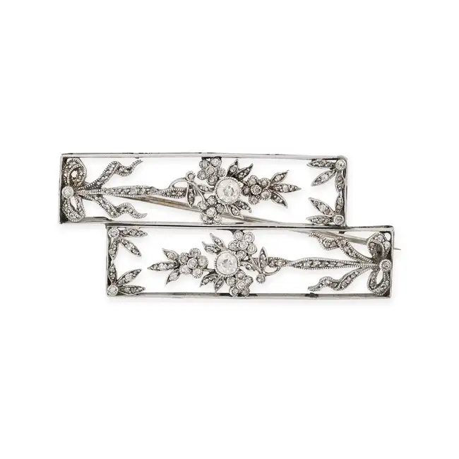AN ANTIQUE DIAMOND BROOCH the openwork brooch comprising two openwork rectangular motifs, accented