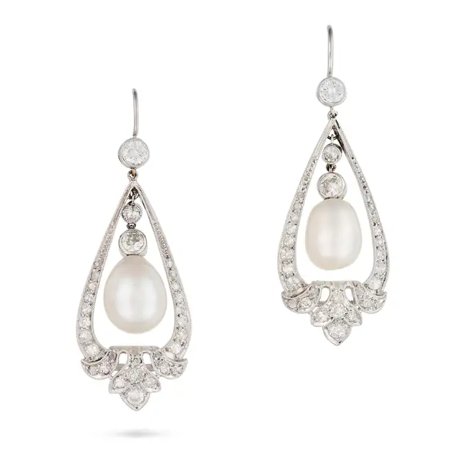 A PAIR OF NATURAL SALTWATER PEARL AND DIAMOND DROP EARRINGS each suspending a pearl drop of 9.4mm