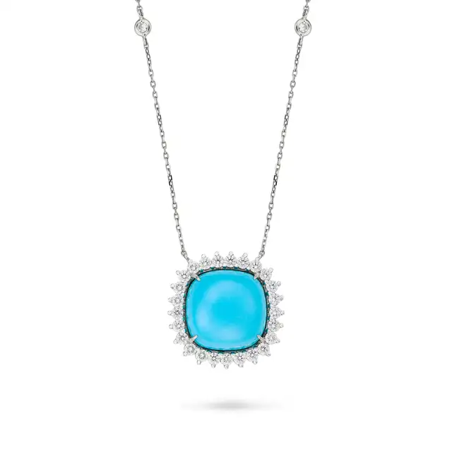 A TURQUOISE AND DIAMOND PENDANT NECKLACE the pendant set with a cabochon turquoise in a cluster of