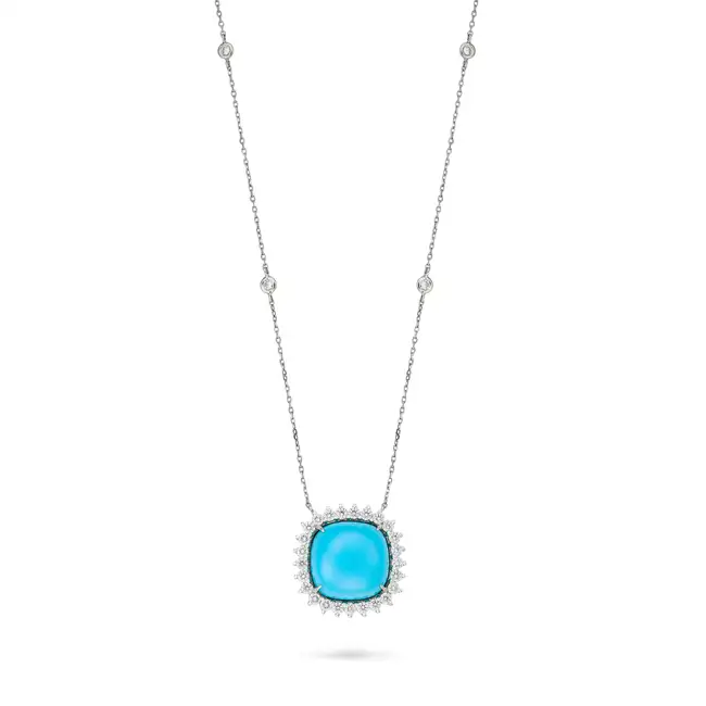 A TURQUOISE AND DIAMOND PENDANT NECKLACE the pendant set with a cabochon turquoise in a cluster of