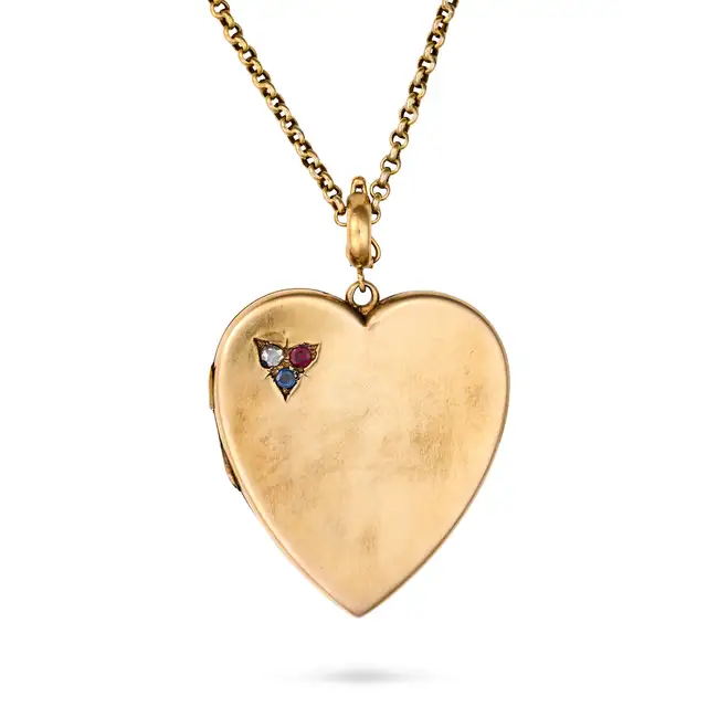 AN ANTIQUE RUBY, SAPPHIRE AND DIAMOND HEART LOCKET PENDANT NECKLACE the locket designed as a