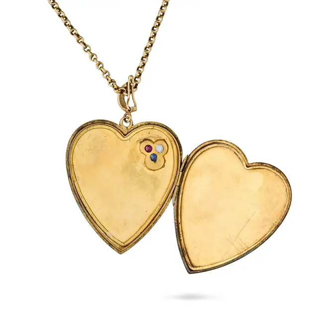 AN ANTIQUE RUBY, SAPPHIRE AND DIAMOND HEART LOCKET PENDANT NECKLACE the locket designed as a