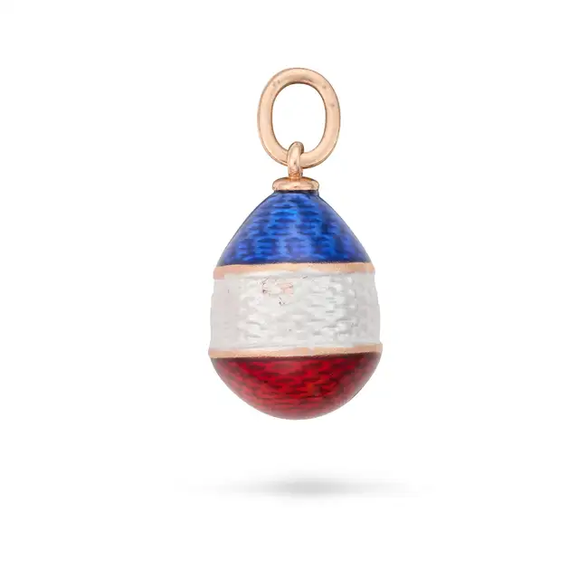 A RUSSIAN ENAMEL EGG PENDANT the egg shaped pendant relieved in stripes of blue, white and red