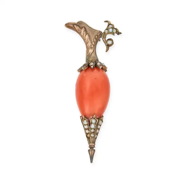 AN ANTIQUE CORAL AND PEARL JUG BROOCH designed as a jug set with a piece of polished coral, accented
