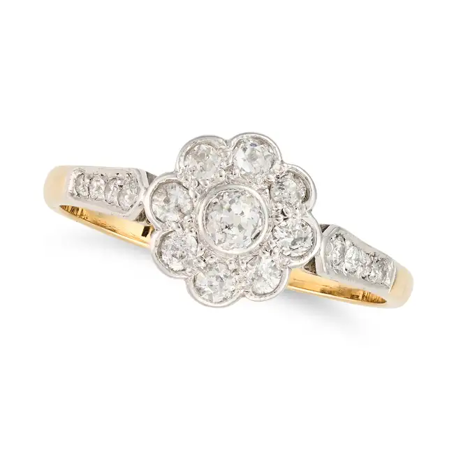 AN ANTIQUE DIAMOND DAISY RING, EARLY 20TH CENTURY AND LATER set with a cluster of old cut