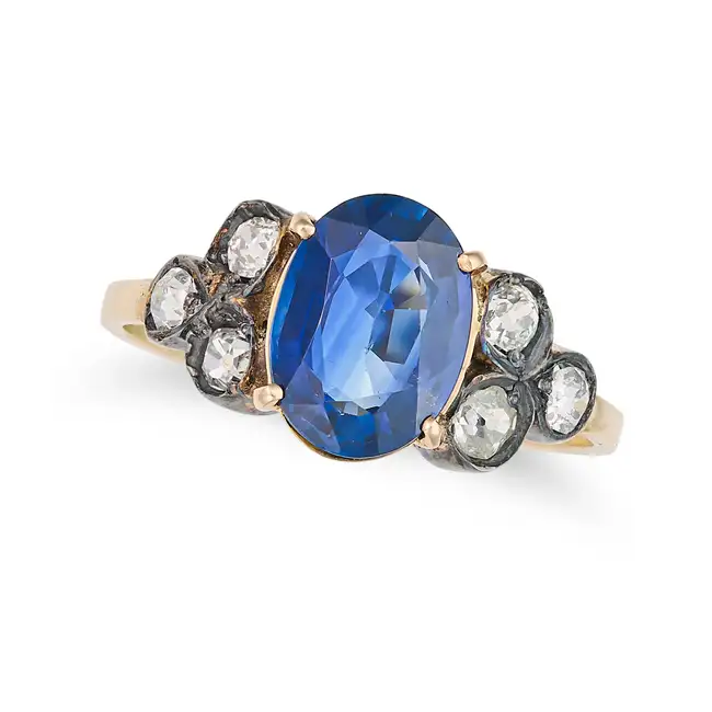 A SAPPHIRE AND DIAMOND RING set with an oval cut sapphire of approximately 2.31 carats, accented