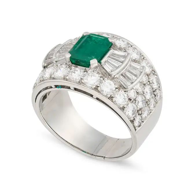 BULGARI, AN EMERALD AND DIAMOND RING in platinum, set with an octagonal step cut emerald of 1.45