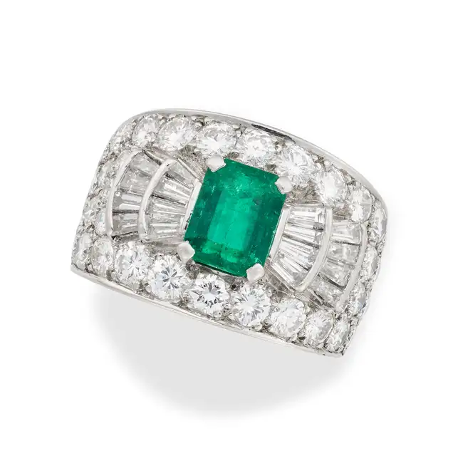 BULGARI, AN EMERALD AND DIAMOND RING in platinum, set with an octagonal step cut emerald of 1.45