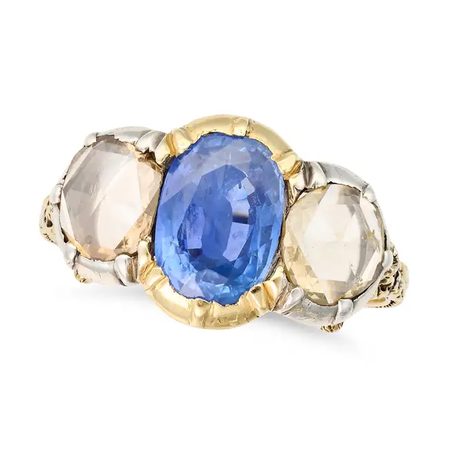 AN ANTIQUE SAPPHIRE AND DIAMOND THREE STONE RING set with an oval cut sapphire of approximately 2.46