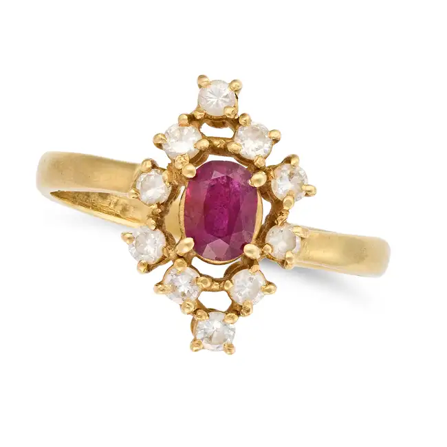 NO RESERVE - A RUBY AND DIAMOND DRESS RING in 18ct yellow gold, set with an oval cut ruby,