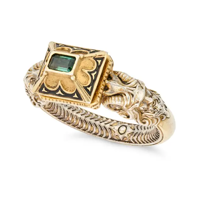 ​A RENAISSANCE REVIVAL RING ​the ornate ring set with a step cut green tourmaline and accented by