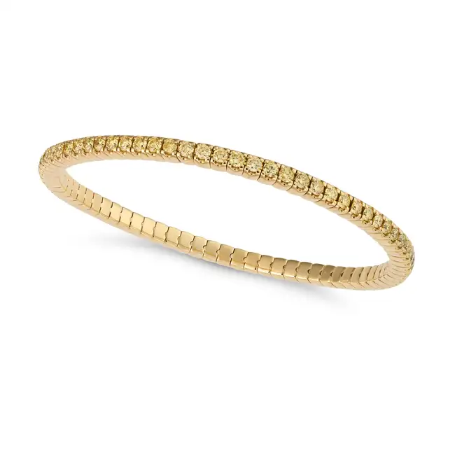 CRIVELLI, A YELLOW DIAMOND FLEXIBLE BRACELET in 18ct yellow gold, the elasticated bracelet set all