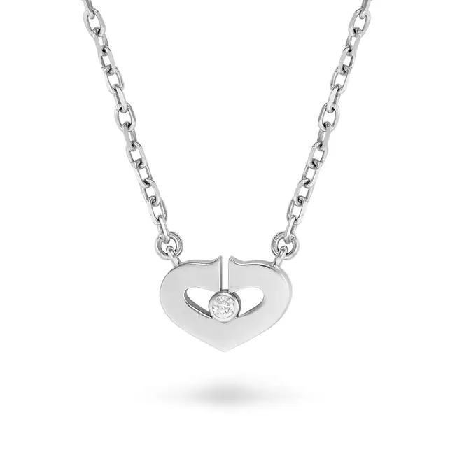 CARTIER, A DIAMOND C DE CARTIER HEART PENDANT NECKLACE the pendant designed as a heart formed of two