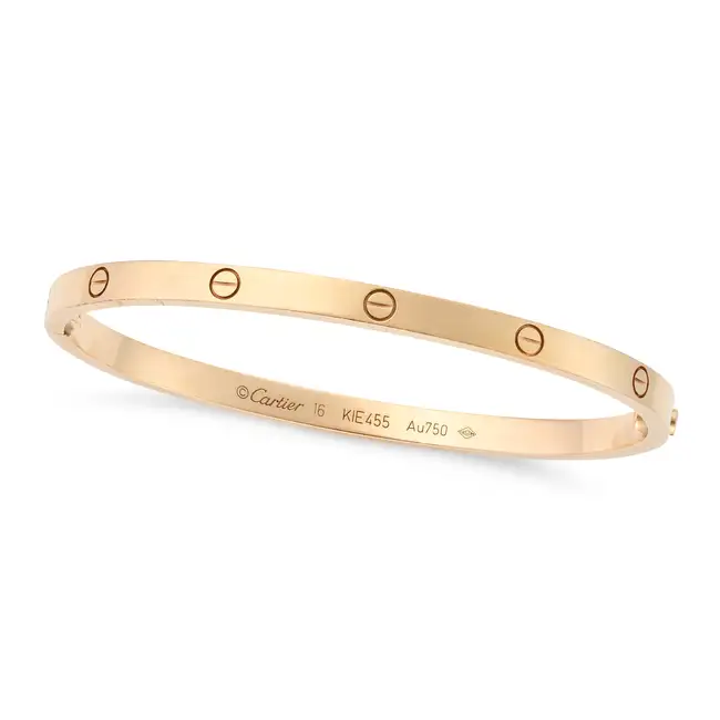 CARTIER, A SMALL MODEL LOVE BANGLE in 18ct rose gold, the hinged bangle punctuated by ten screw head