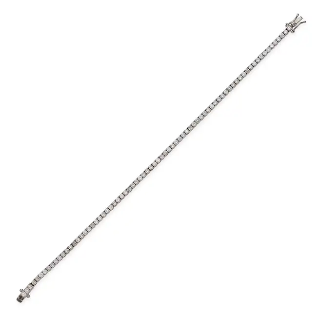 A DIAMOND LINE BRACELET comprising a row of round brilliant cut diamonds totalling 3.0-3.2 carats,
