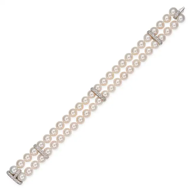 MIKIMOTO, A FINE AKOYA PEARL AND DIAMOND BRACELET in 18ct white gold, comprising two rows of pearls,