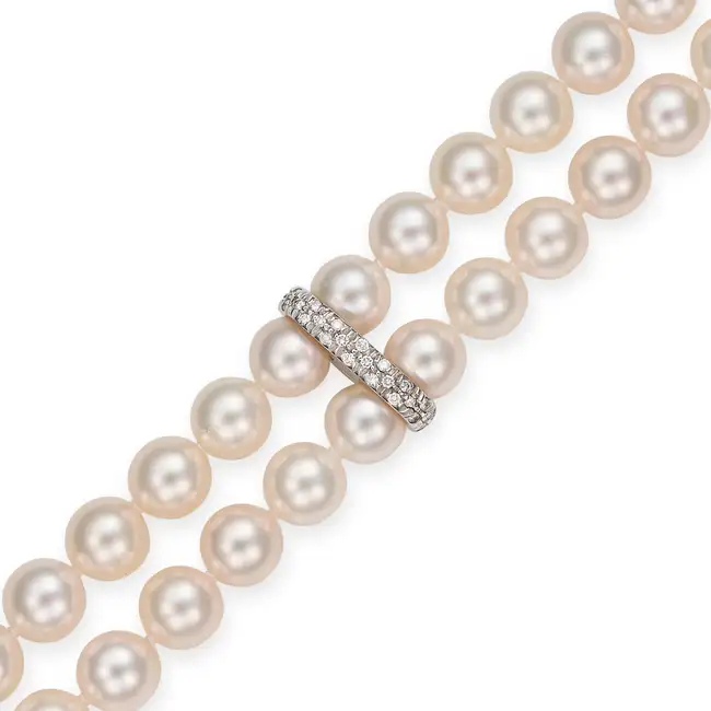 MIKIMOTO, A FINE AKOYA PEARL AND DIAMOND BRACELET in 18ct white gold, comprising two rows of pearls,