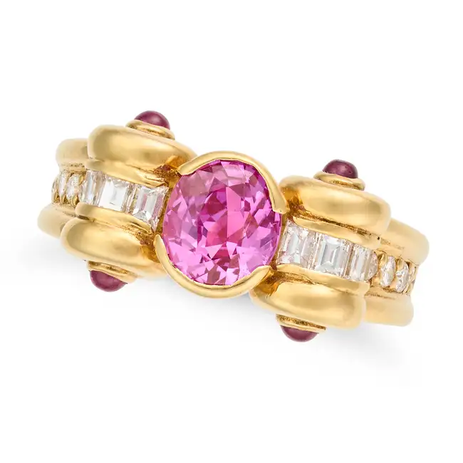 AN UNHEATED PINK SAPPHIRE, RUBY AND DIAMOND DRESS RING set with an oval cut pink sapphire of 1.48