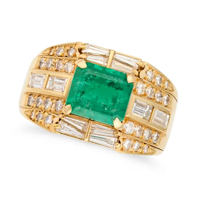 AN EMERALD AND DIAMOND DRESS RING set with an octagonal step cut emerald of 2.32 carats, accented by