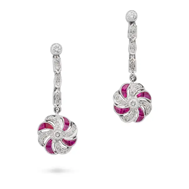 NO RESERVE - A PAIR OF RUBY AND DIAMOND DROP EARRINGS in 18ct white gold, each set with a row of