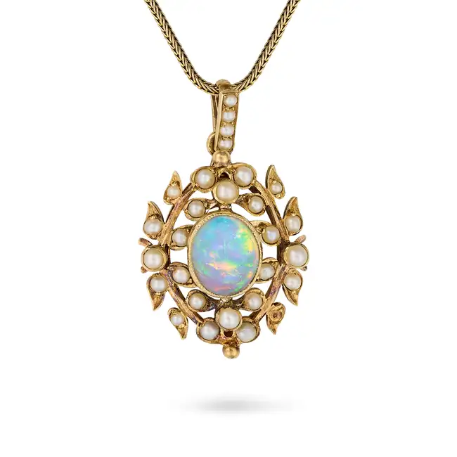 AN ANTIQUE OPAL AND DIAMOND PENDANT NECKLACE the pendant set with a cabochon opal in a foliate