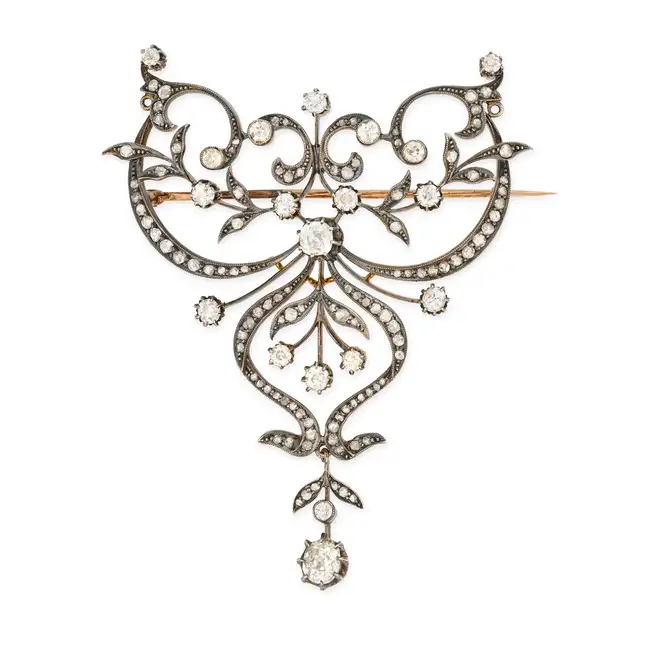 A FINE ANTIQUE DIAMOND BROOCH, LATE 19TH CENTURY in yellow gold and silver, the scrolling openwork