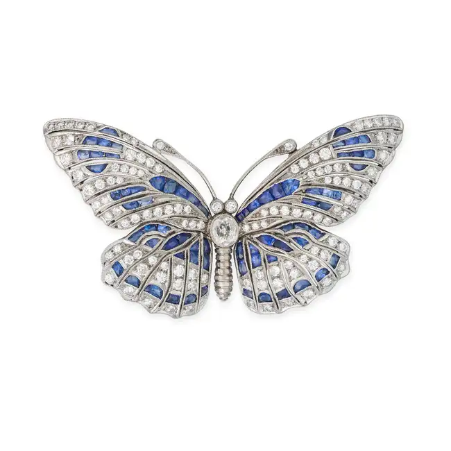 A FINE SAPPHIRE AND DIAMOND BUTTERFLY BROOCH designed as a butterfly, the body set with an oval