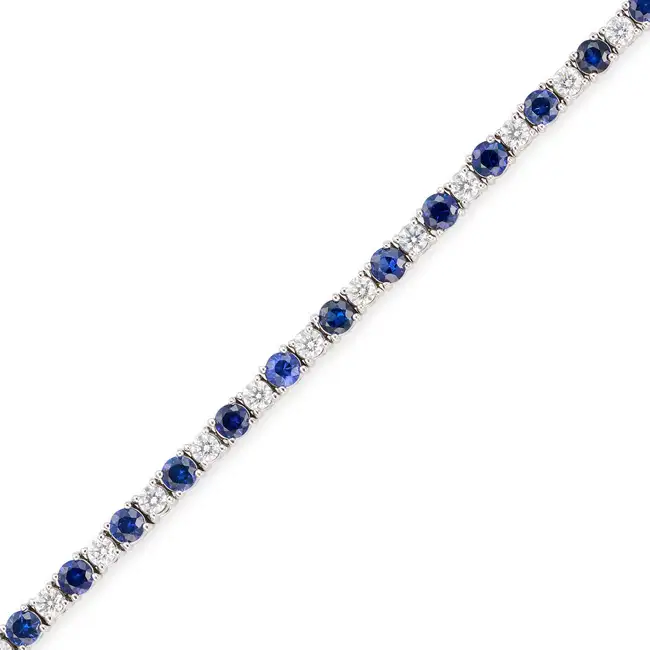 MAPPIN & WEBB, A SAPPHIRE AND DIAMOND LINE BRACELET in 18ct white gold, comprising a row of