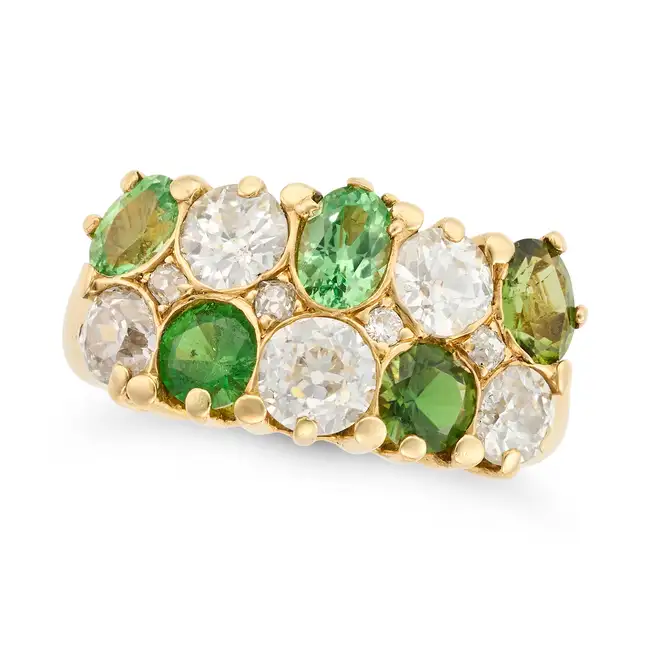 AN ANTIQUE GREEN GARNET, PERIDOT AND DIAMOND CHEQUERBOARD RING in yellow gold, set with oval and