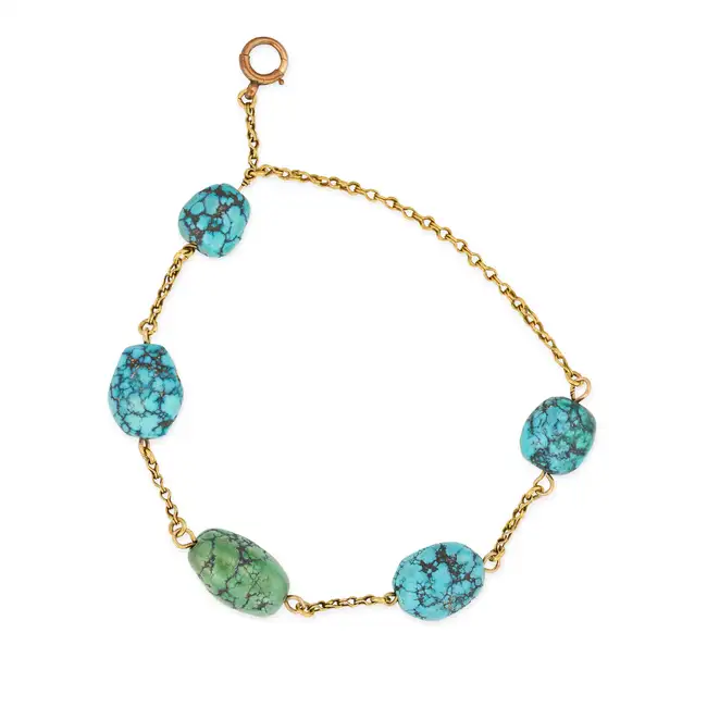 NO RESERVE - A VINTAGE TURQUOISE NUGGET BRACELET in yellow gold, comprising a chain set with five