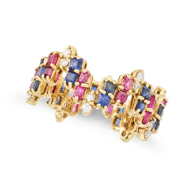 A SAPPHIRE, RUBY AND DIAMOND RING in stylised design, set throughout with round cut diamonds and