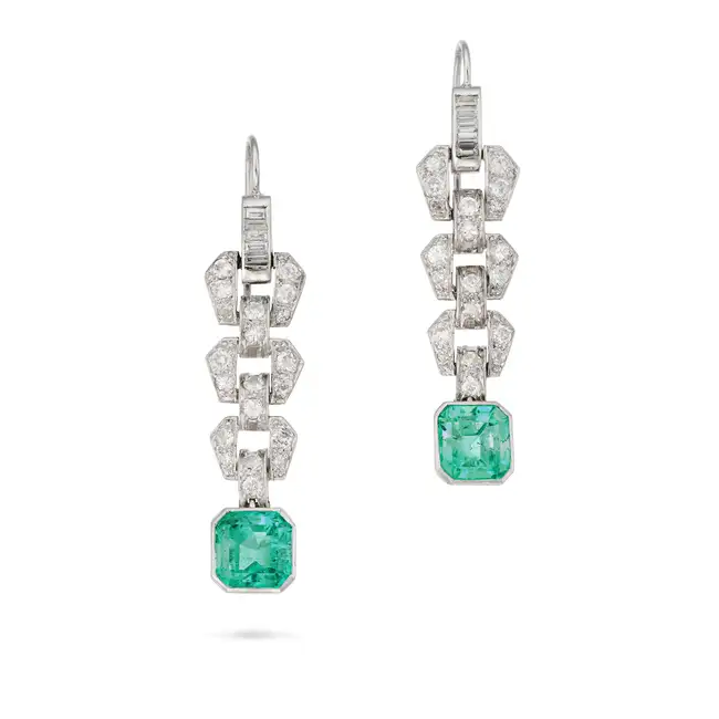A PAIR OF ART DECO EMERALD AND DIAMOND DROP EARRINGS the articulated geometric bodies set with