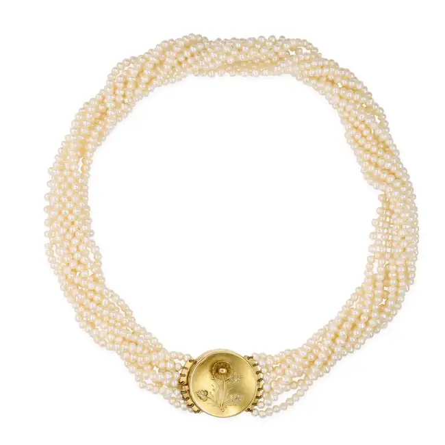 A PEARL LOCKET CHOKER NECKLACE comprising eight strands of pearls, the circular clasp with an