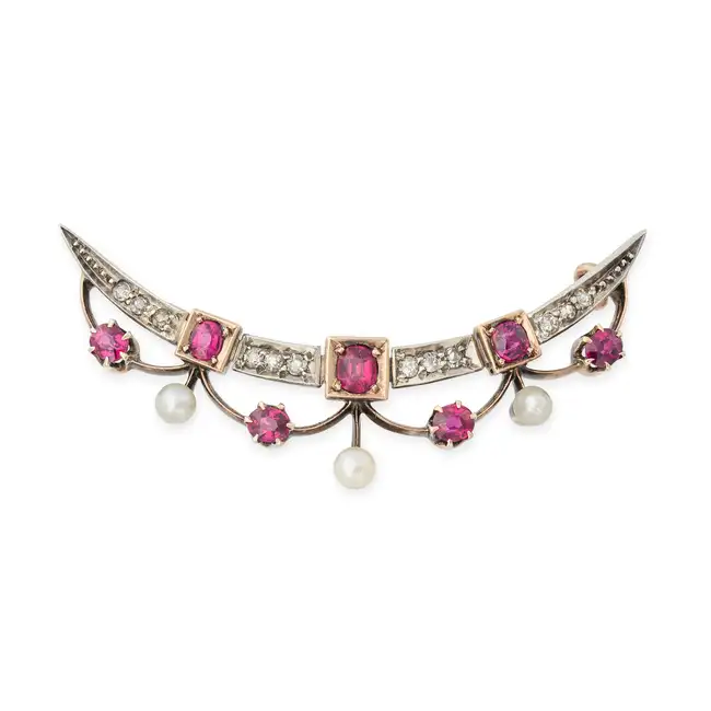 AN ANTIQUE RUBY, DIAMOND AND PEARL CRESCENT BROOCH in yellow gold and silver, designed as a crescent