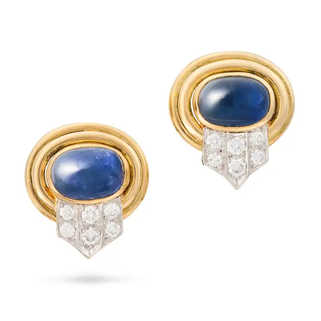 A PAIR OF VINTAGE SAPPHIRE AND DIAMOND CLIP EARRINGS each set with an oval cabochon sapphire