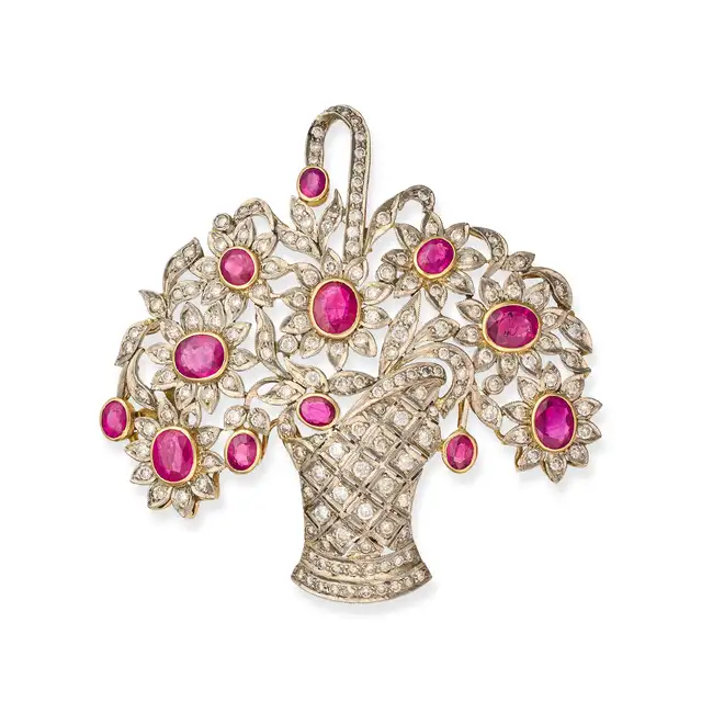 A FINE VINTAGE RUBY AND DIAMOND FLOWER BASKET BROOCH, CIRCA 1950 designed as a basket of flowers,