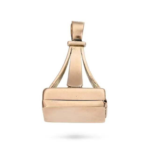 AN ANTIQUE GOLD FOB / LOCKET in 9ct yellow gold, the fob terminating with a hinged locket