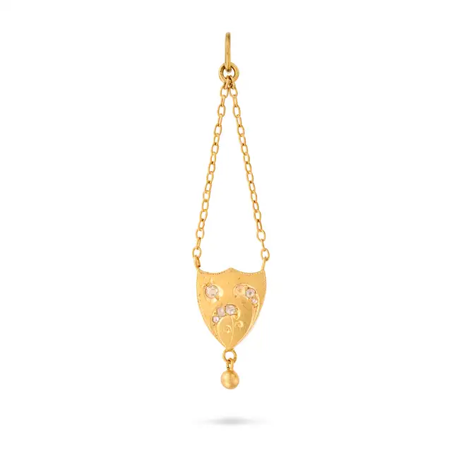AN ANTIQUE DIAMOND PENDANT the shield shaped pendant with floral motifs set with old and rose cut