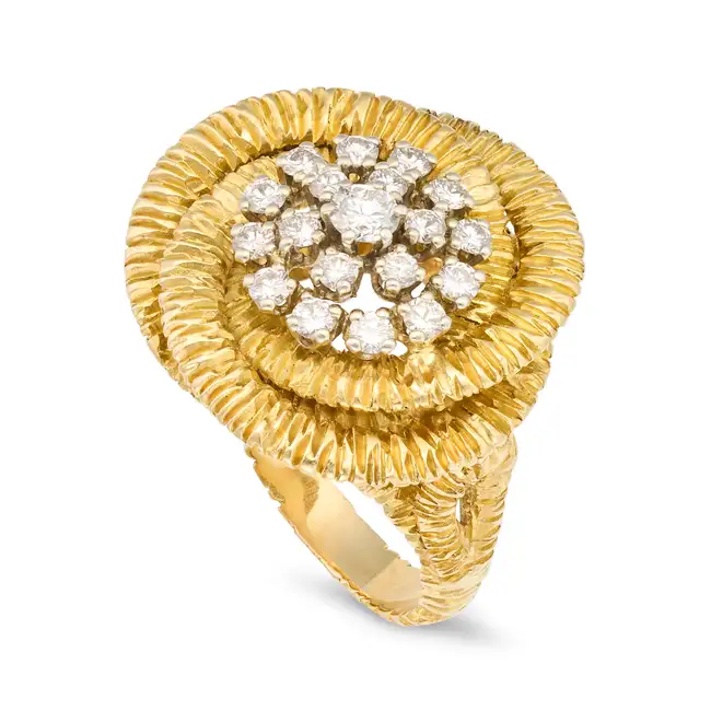 A DIAMOND DRESS RING set with a cluster of round brilliant cut diamonds totalling 0.6-0.7 carats,