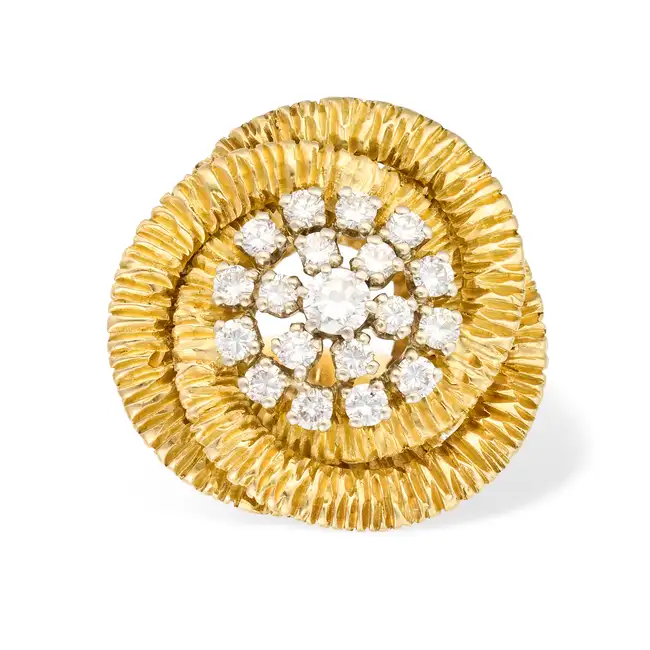 A DIAMOND DRESS RING set with a cluster of round brilliant cut diamonds totalling 0.6-0.7 carats,