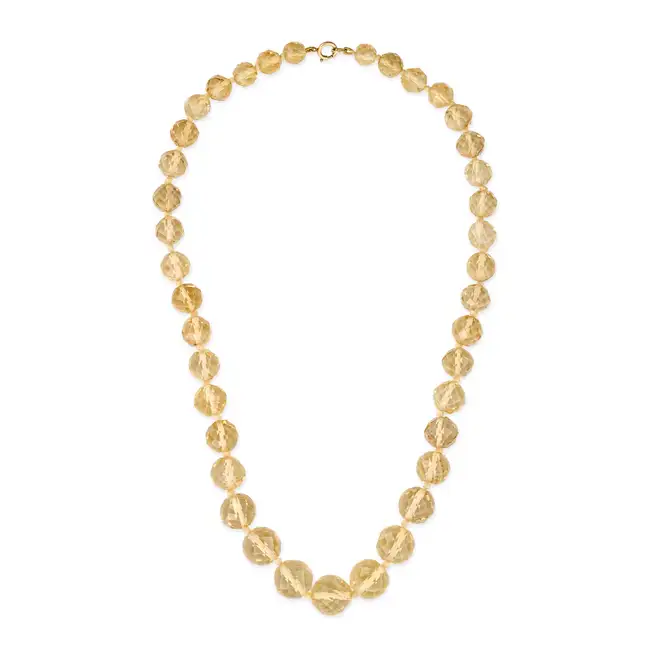 NO RESERVE - A CITRINE BEAD NECKLACE comprising a single row of graduating facetted citrine beads,
