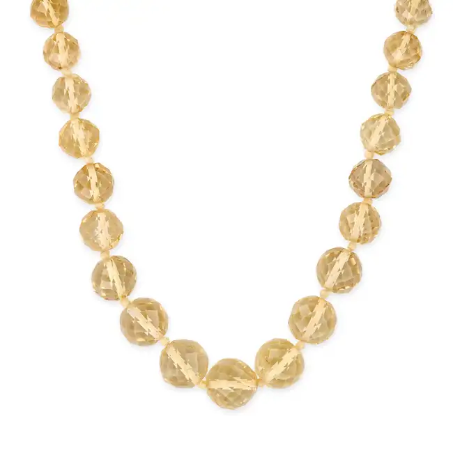 NO RESERVE - A CITRINE BEAD NECKLACE comprising a single row of graduating facetted citrine beads,