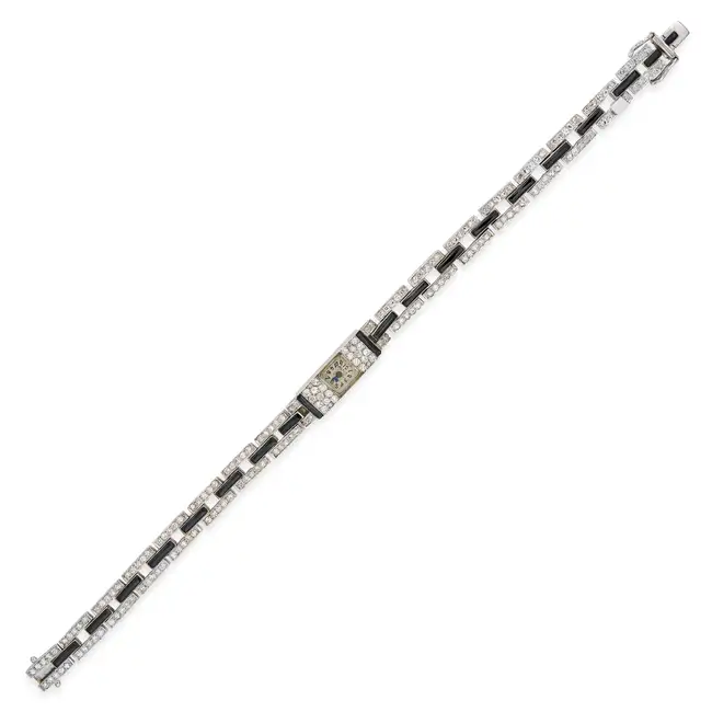 MARZO, A FINE ART DECO ONYX AND DIAMOND COCKTAIL WATCH the rectangular dial with Arabic numerals,