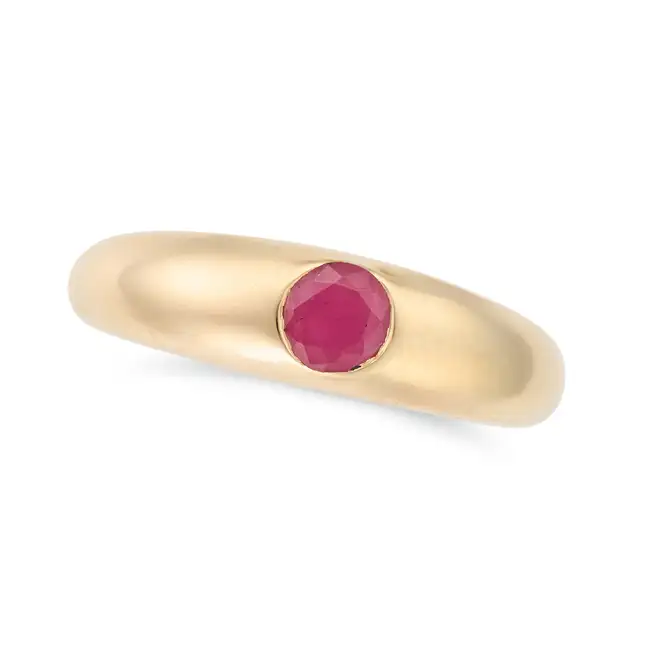 A RUBY RING set with a round cut ruby of 0.55 carats, inscribed 0.55CT, stamped 14K, size N / 6.