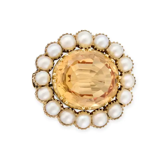 A FINE IMPERIAL TOPAZ AND PEARL CLUSTER BROOCH set with an oval cut imperial topaz of