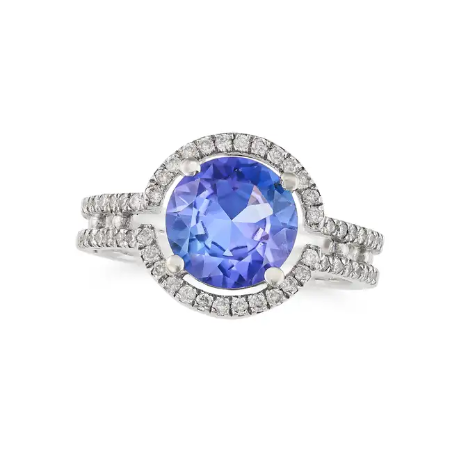 A TANZANITE AND DIAMOND RING in 18ct white gold, set with a round cut tanzanite of approximately 1.