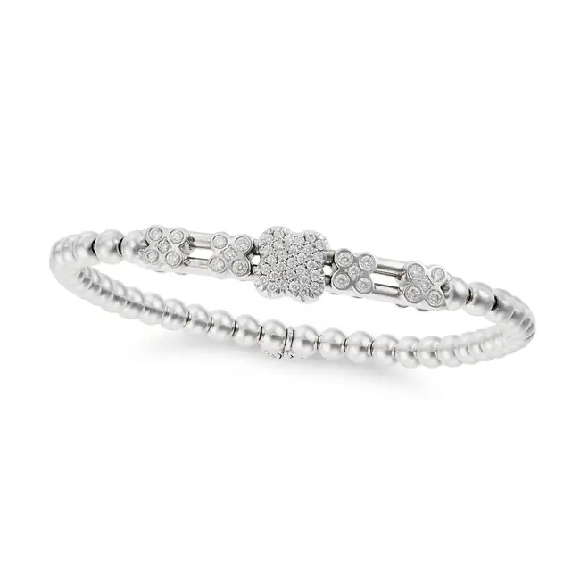 HULCHI BELLUNI, A DIAMOND MOVEABLE BRACELET in 18ct white gold, comprising five moveable clusters of