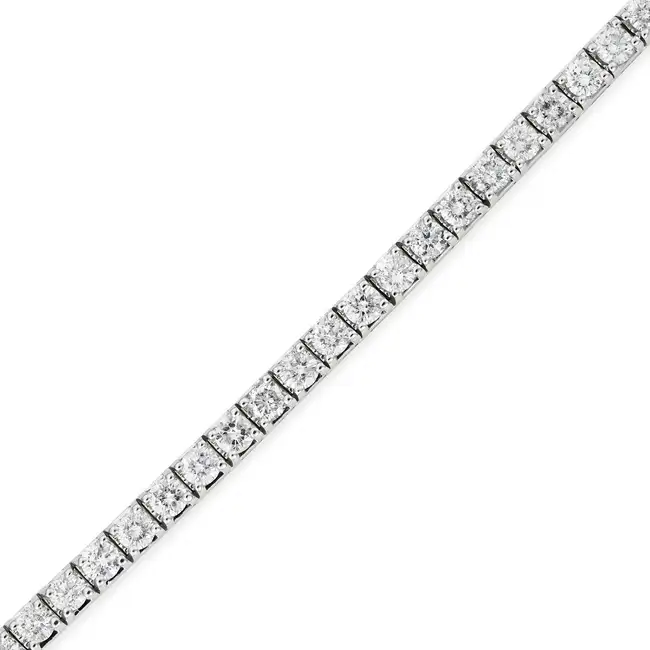 A 7.00 CARAT DIAMOND LINE BRACELET set with a row of thirty nine round brilliant cut diamonds all