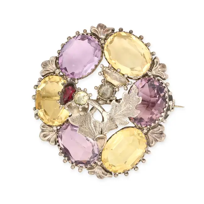 NO RESERVE - AN ANTIQUE VICTORIAN CITRINE AND AMETHYST SCOTTISH THISTLE BROOCH in silver, comprising